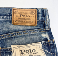 Varick Slim Straight Distressed Jeans