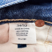 Varick Slim Straight Distressed Jeans